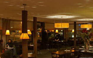 O-ring and small pendant lights in ash wood in restaurant